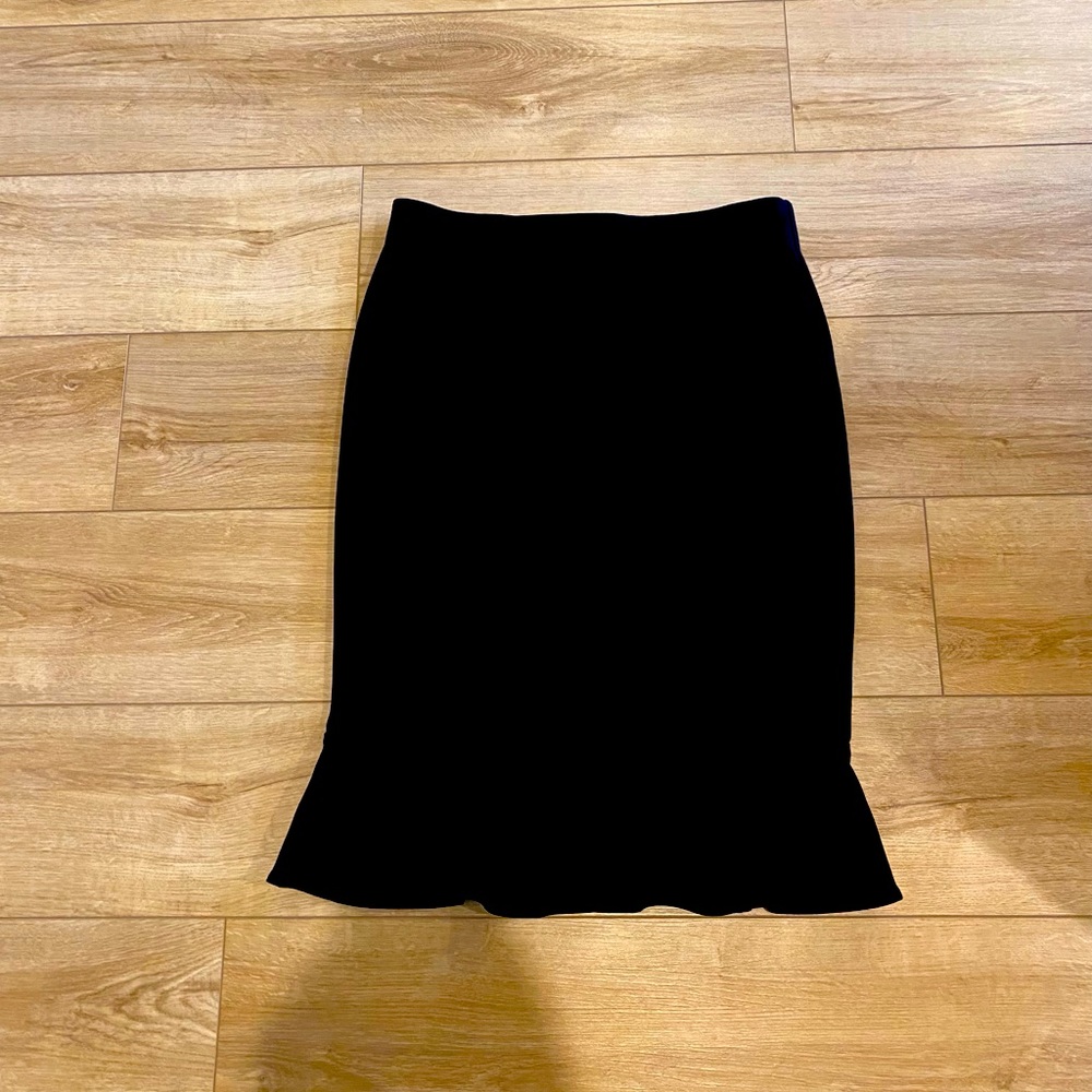 Black skirt with flounce hem. Size 2/4
